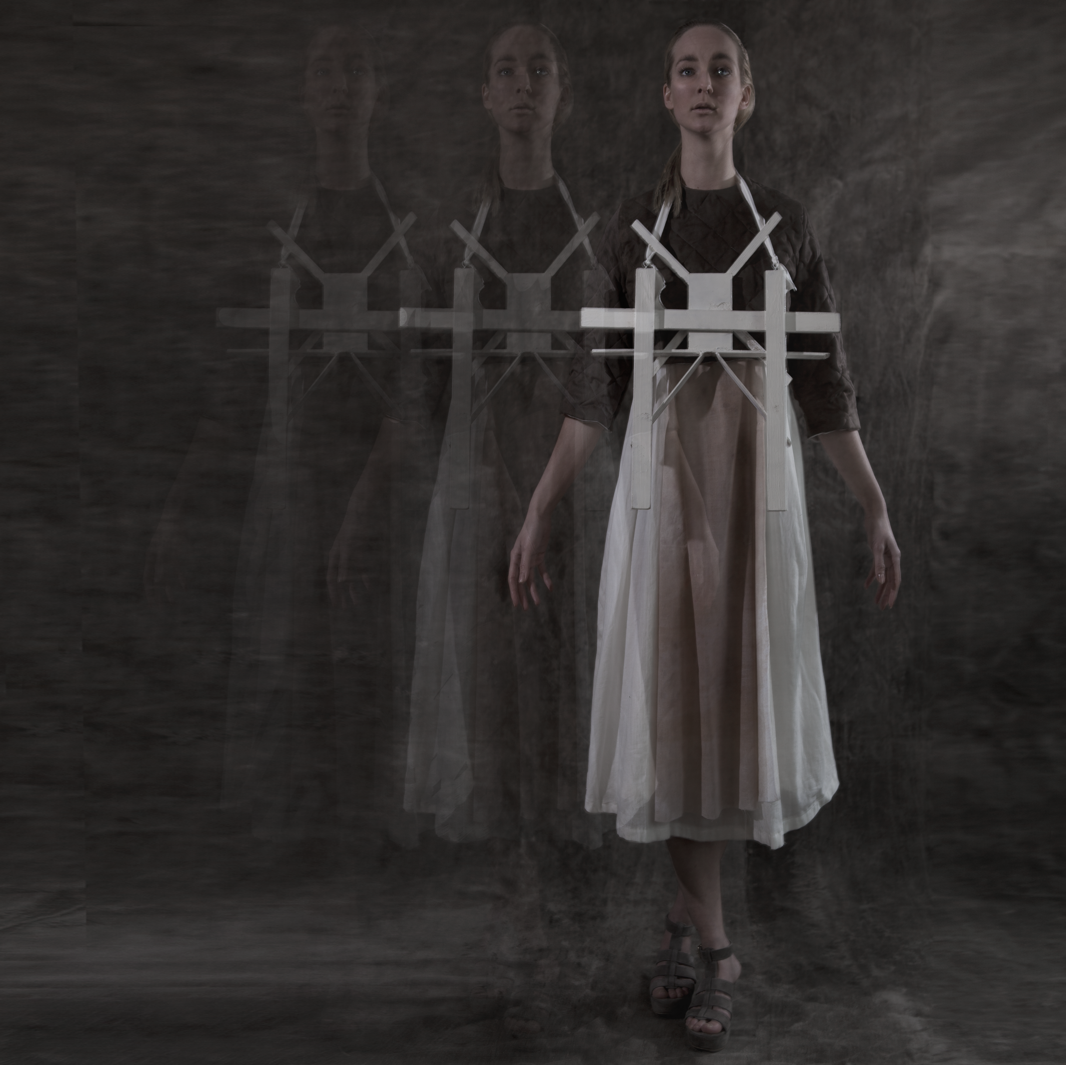 Cross-Bearer — full length double exposure of figure in transparent dress with cross harness — Julia Krantz